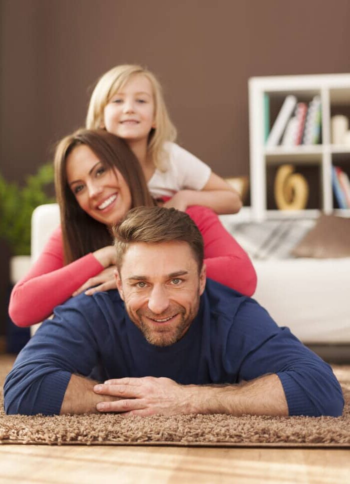 Happy family on carpet